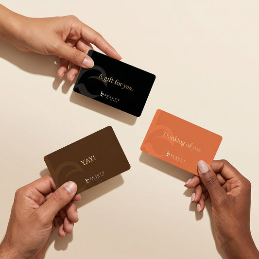 Hands holding Beauty By Earth Giftcards