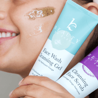 Person holding two skincare products with visible branding