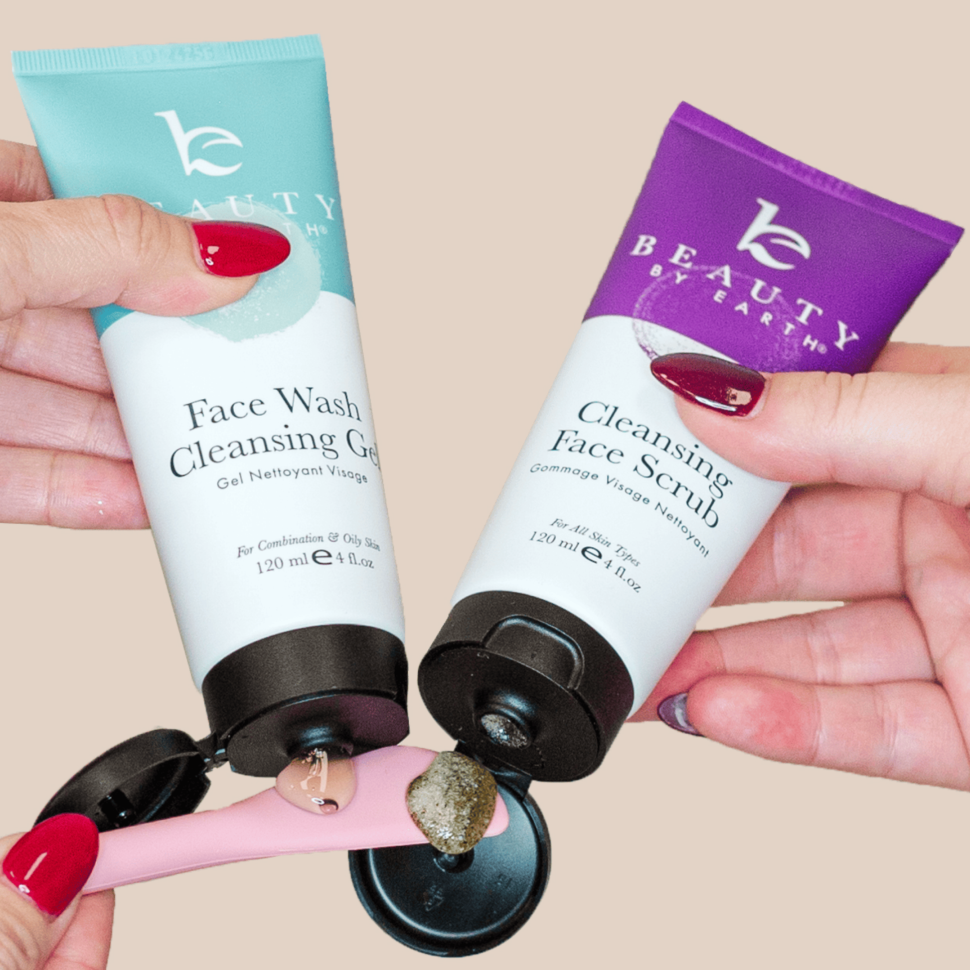 Two skincare products from Beauty by Earth held by hands with red nail polish on a beige background.