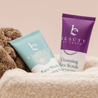 Two Beauty by Earth skincare products on a textured surface with a neutral background