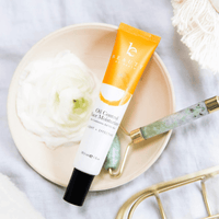 Oil control face moisturizer tube next to face roller