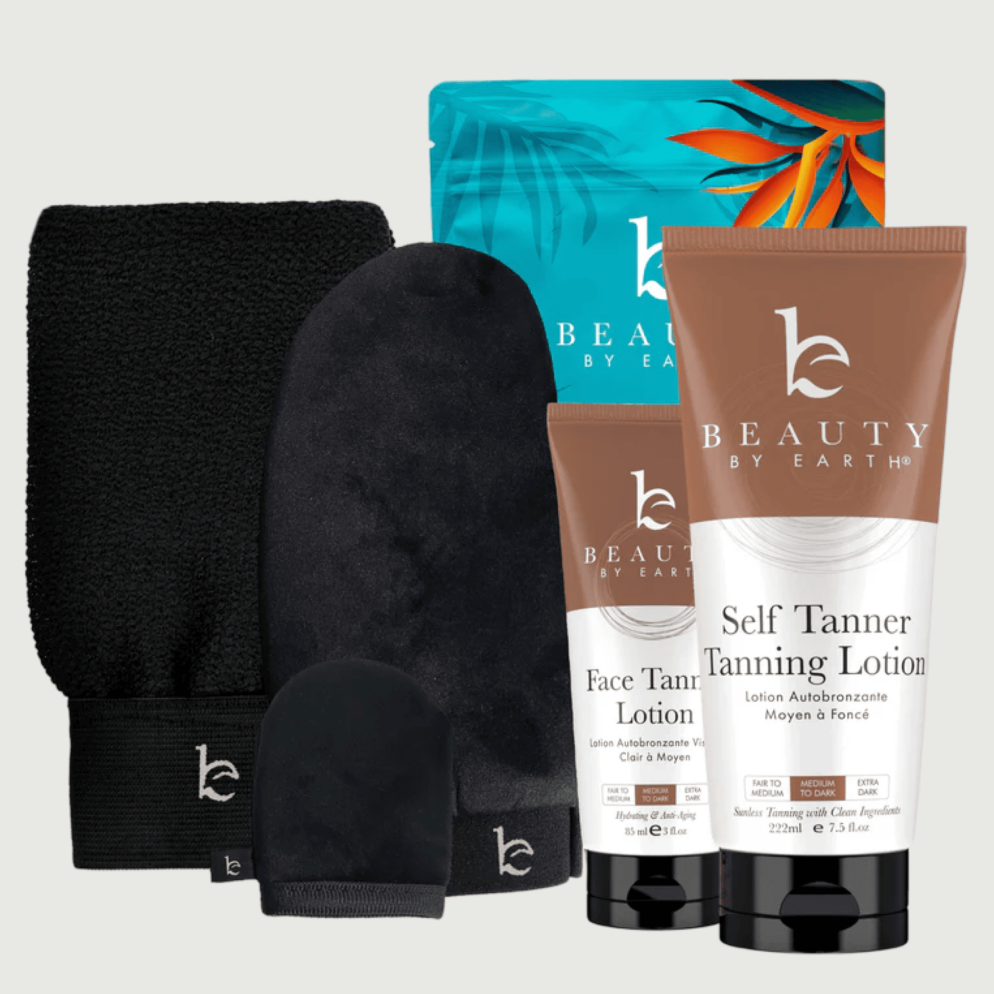 Beauty by Earth self tanner tanning lotion and face lotion tubes, next to the self tanning applicator kit with body, face and exfoliating mitt