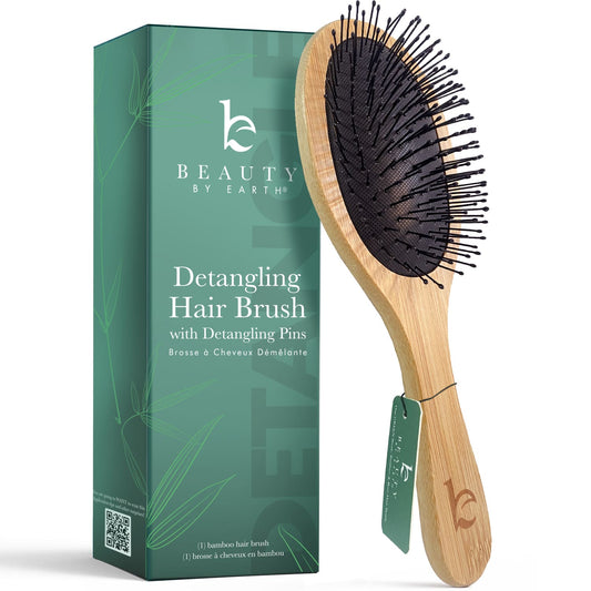 Detangling hair brush with packaging on a white background