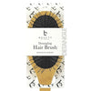 Detangling hair brush packaging with 'Beauty by Earth' branding on a white background