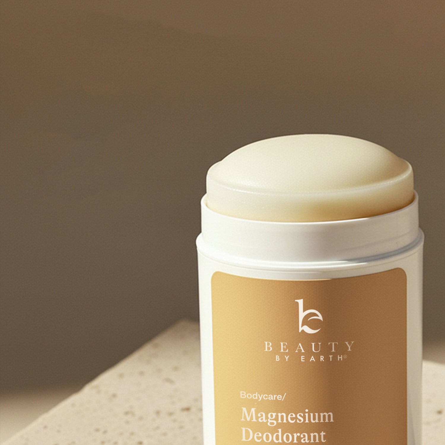 Beauty by Earth magnesium deodorant stick on a neutral background