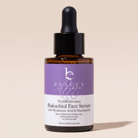Beauty by Earth Bakuchiol Face Serum bottle with a dropper against a warm beige background.