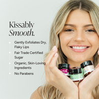 Blonde woman poses with 3 lip scrubs on her hand. Benefit bullet points:: kissably smootnh.