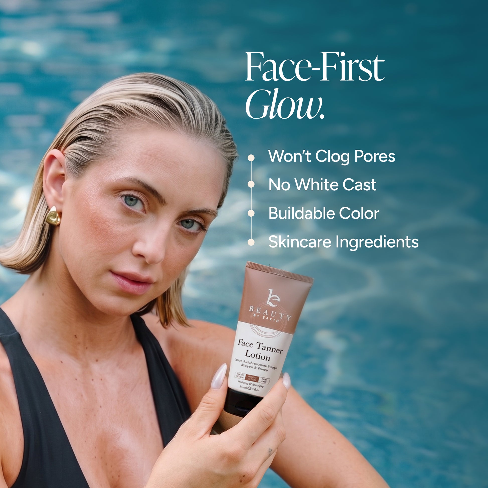 A woman in a black swimsuit holds a tube of Beauty by Earth Face Tanner Lotion in front of a blue swimming pool background. White text on the right reads 'Face-First Glow' with bullet points listing product benefits.