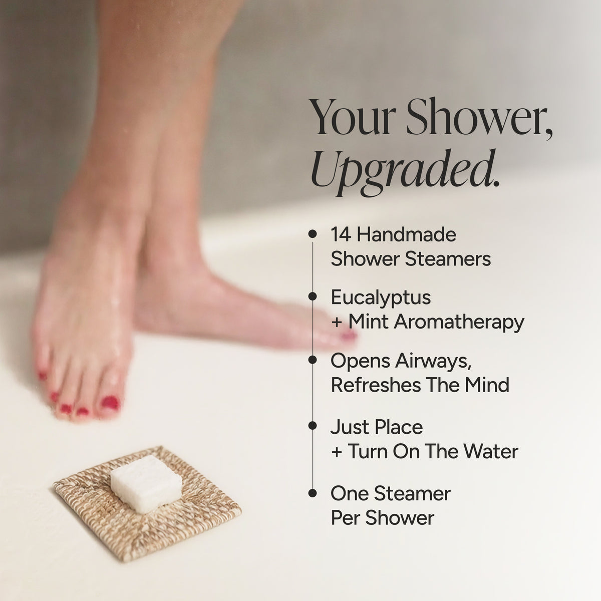 Promotional graphic for shower steamers featuring a person's feet and a small square dish of white steamers on a woven mat. Text on the right reads, 'Your Shower, Upgraded.