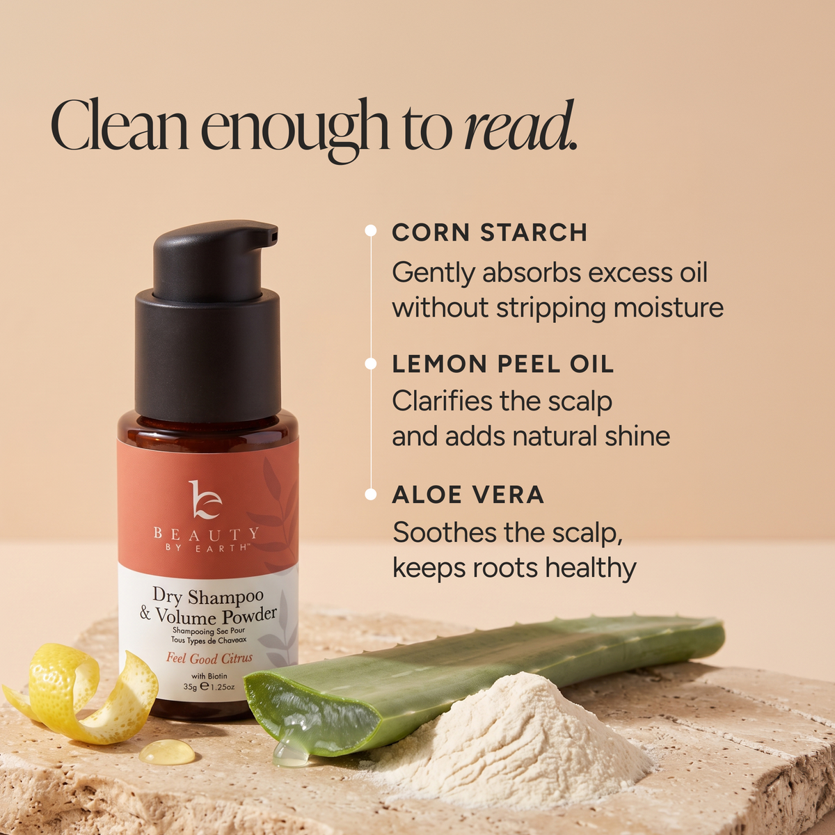 Beauty by Earth dry shampoo and volume powder bottle on a beige background with ingredient callouts and aloe vera and cornstarch props.