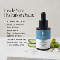 Hyaluronic Acid Serum by Beauty by Earth in an amber glass dropper bottle with a blue and white label, styled on a light stone surface with aloe vera slices, green tea leaves, and text describing key ingredients.