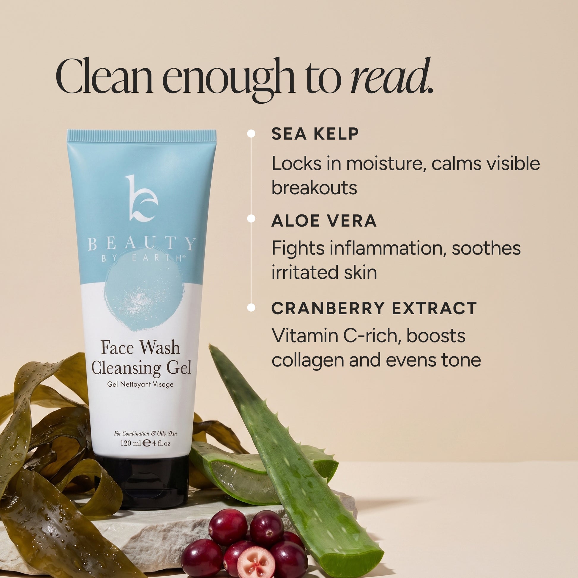 A tube of BEAUTY BY EARTH Face Wash Cleansing Gel stands on a beige surface with sea kelp, aloe vera, and cranberries around it. Text on the image lists key ingredients: sea kelp, aloe vera, and cranberry extract.
