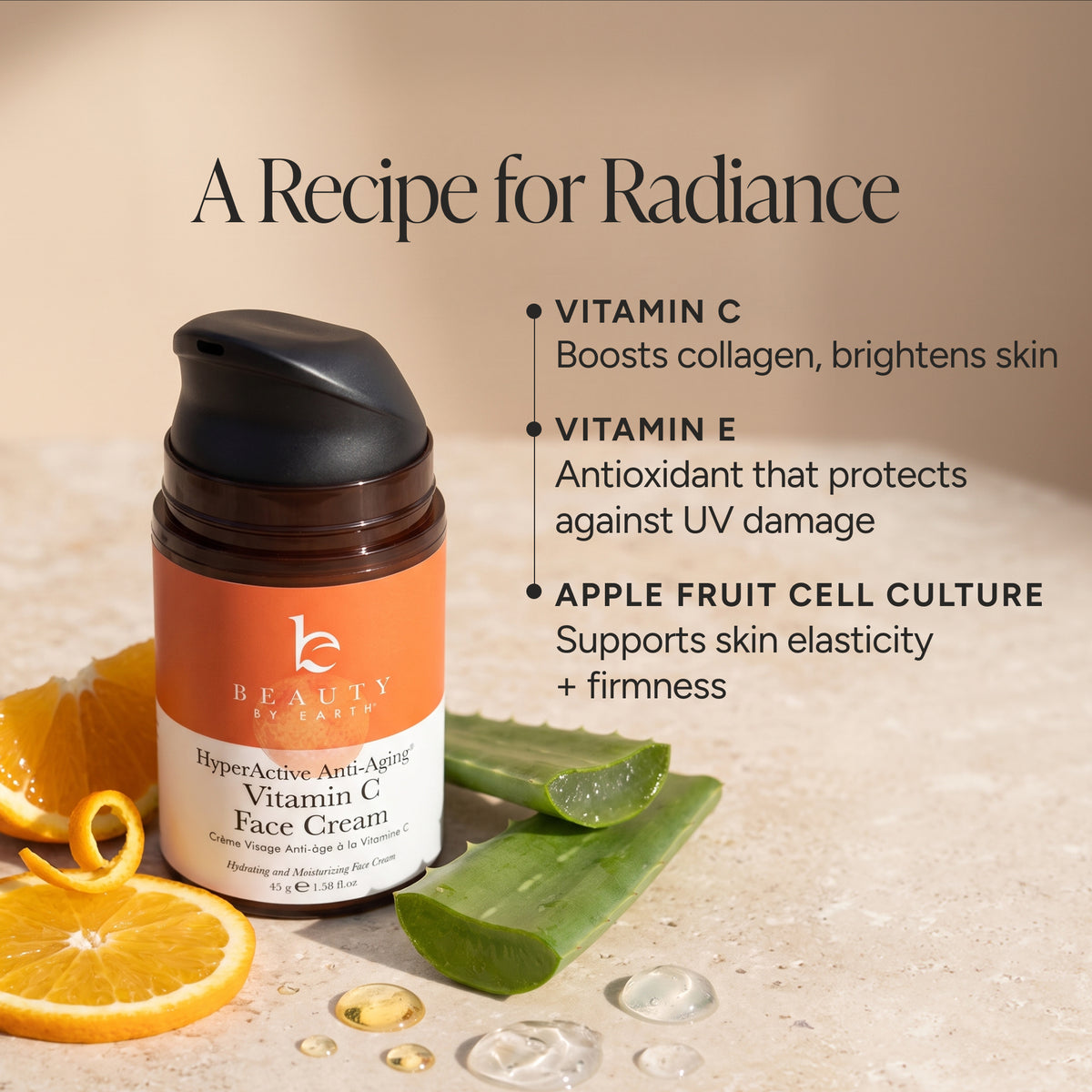 Beauty by Earth HyperActive Anti-Aging Vitamin C Face Cream in a brown bottle with an orange and white label, styled with orange slices, aloe vera, and gold droplets on a beige textured background with product benefits text.