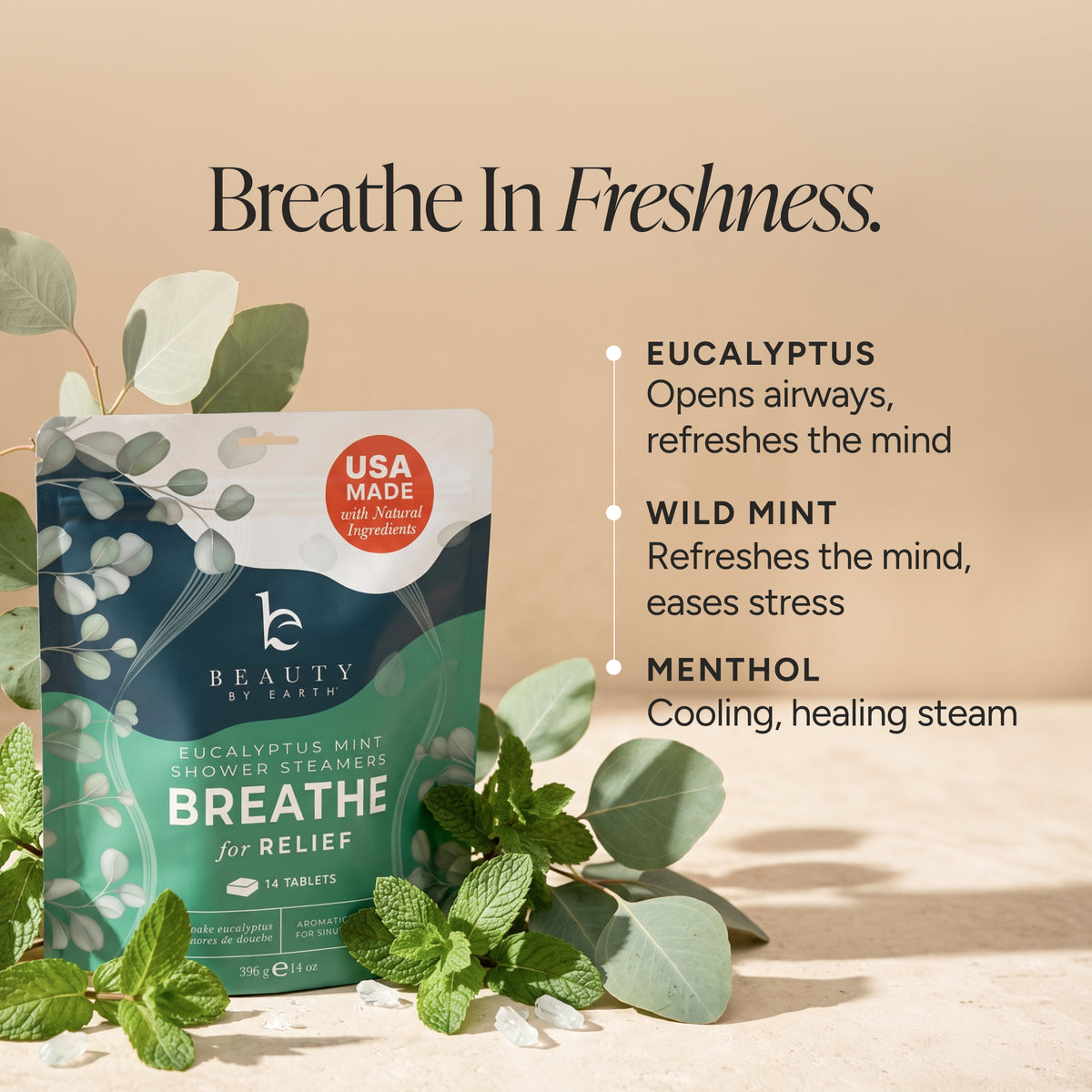 Beauty by Earth Breathe shower steam packet in eucalyptus mint, styled with fresh eucalyptus and mint leaves on a warm beige background with descriptive text.