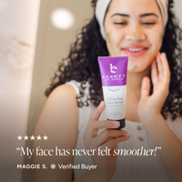 A woman holding a purple and white tube of Cleansing Face Scrub, with a five-star review overlay and the text 'My face has never felt smoother!' and 'Maggie S. Verified Buyer'.