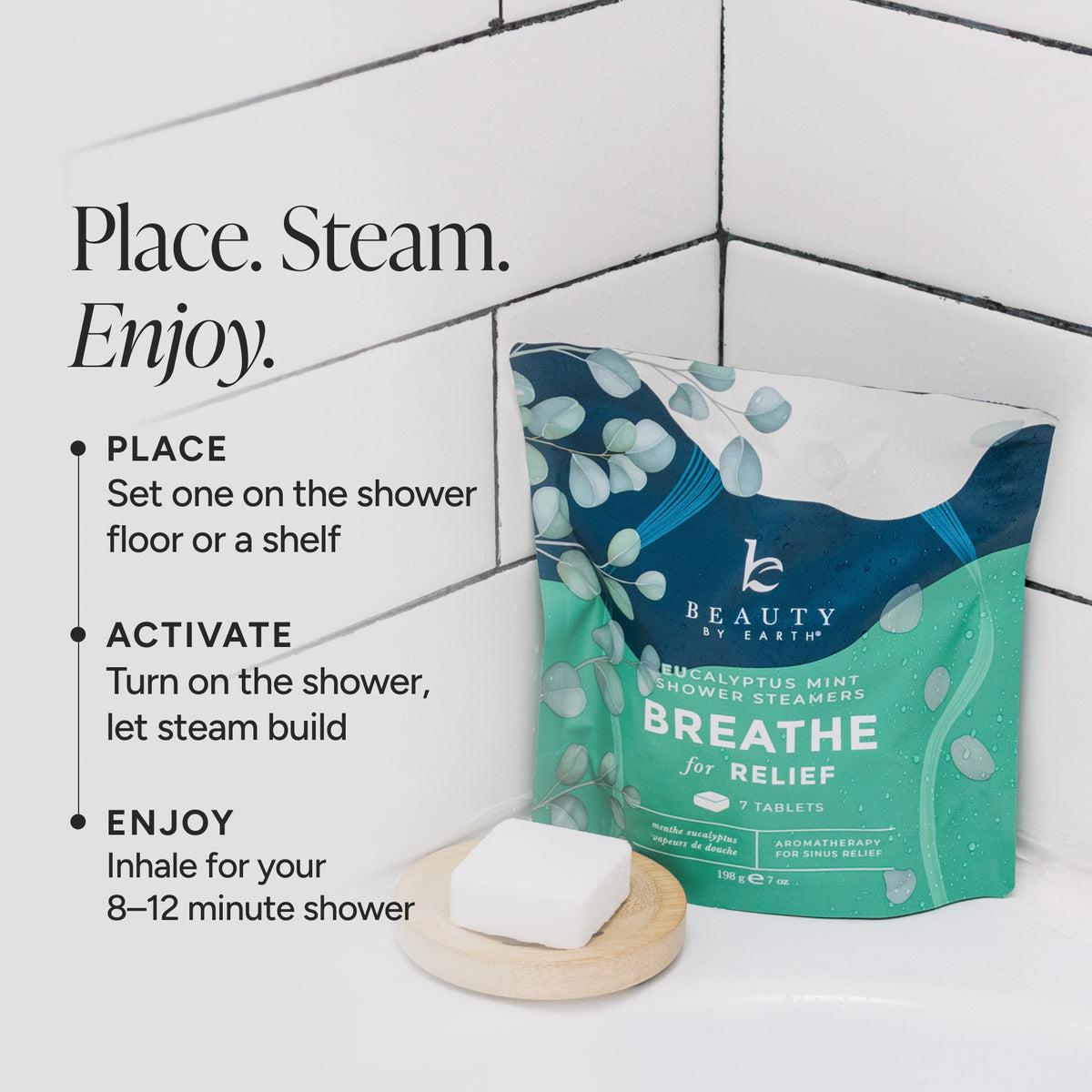 Beauty by Earth Breathe for Relief Eucalyptus Mint Shower Steamers packaging bag displayed next to a soap dish with a bar of soap on a white tiled background, with instructional text on the left.