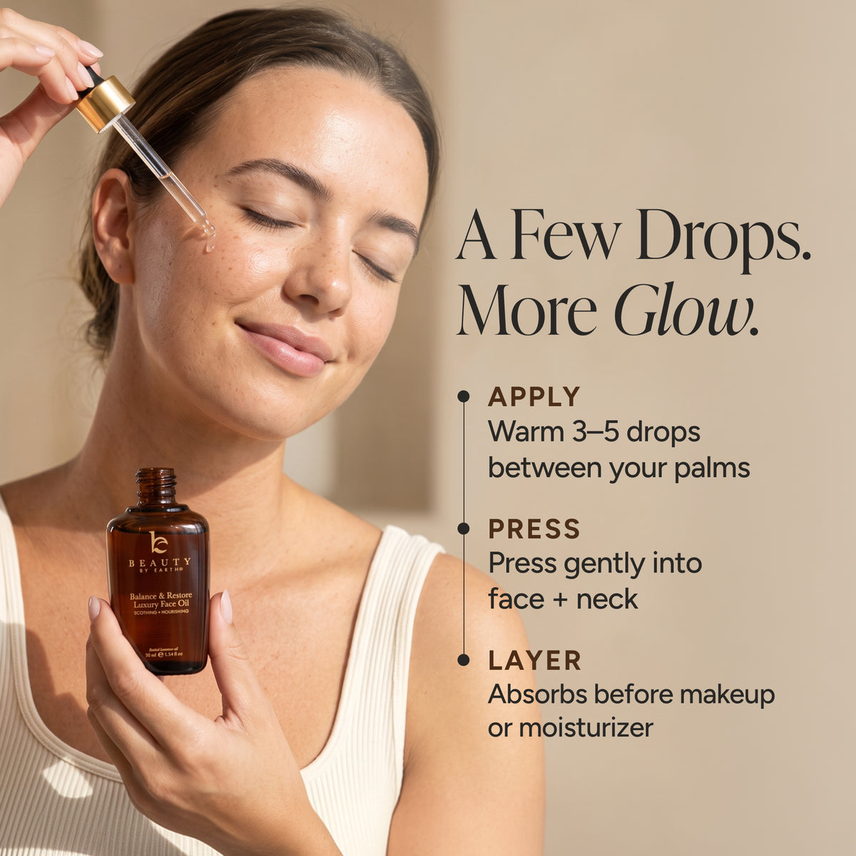 A woman applies a skincare oil dropper to her cheek while holding an amber bottle. Text on the right reads, 'A Few Drops.
