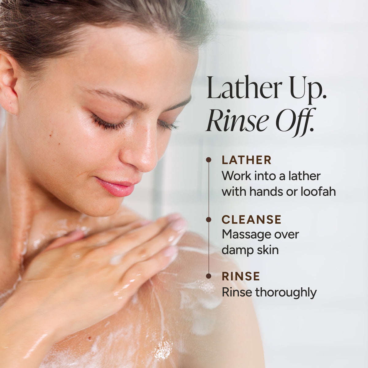 A woman with soap lather on her shoulder and upper chest, shown in a close-up with instructional text reading 'Lather Up. Rinse Off.