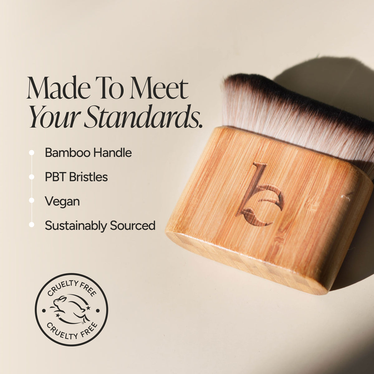 A bamboo-handled  brush with soft bristles, shown on a warm beige background with marketing text highlighting bamboo handle, PBT bristles, vegan formula, and sustainably sourced materials. A circular cruelty-free logo appears in the lower left.