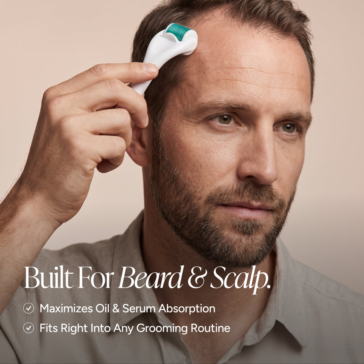 A man with a beard applies a grooming device to his scalp and forehead. The device is white with a green roller head.