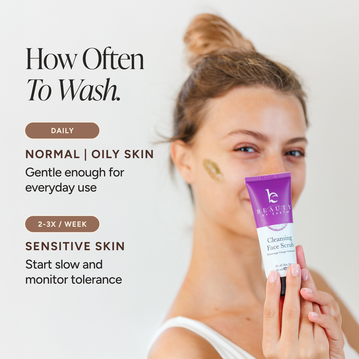 A woman holds a purple and white tube of Cleansing Face Scrub next to text explaining how often to wash a face based on skin type.
