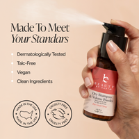 A hand holding and spraying a bottle of Beauty by Earth Dry Shampoo & Volume Powder against a warm beige background with marketing text and icons.