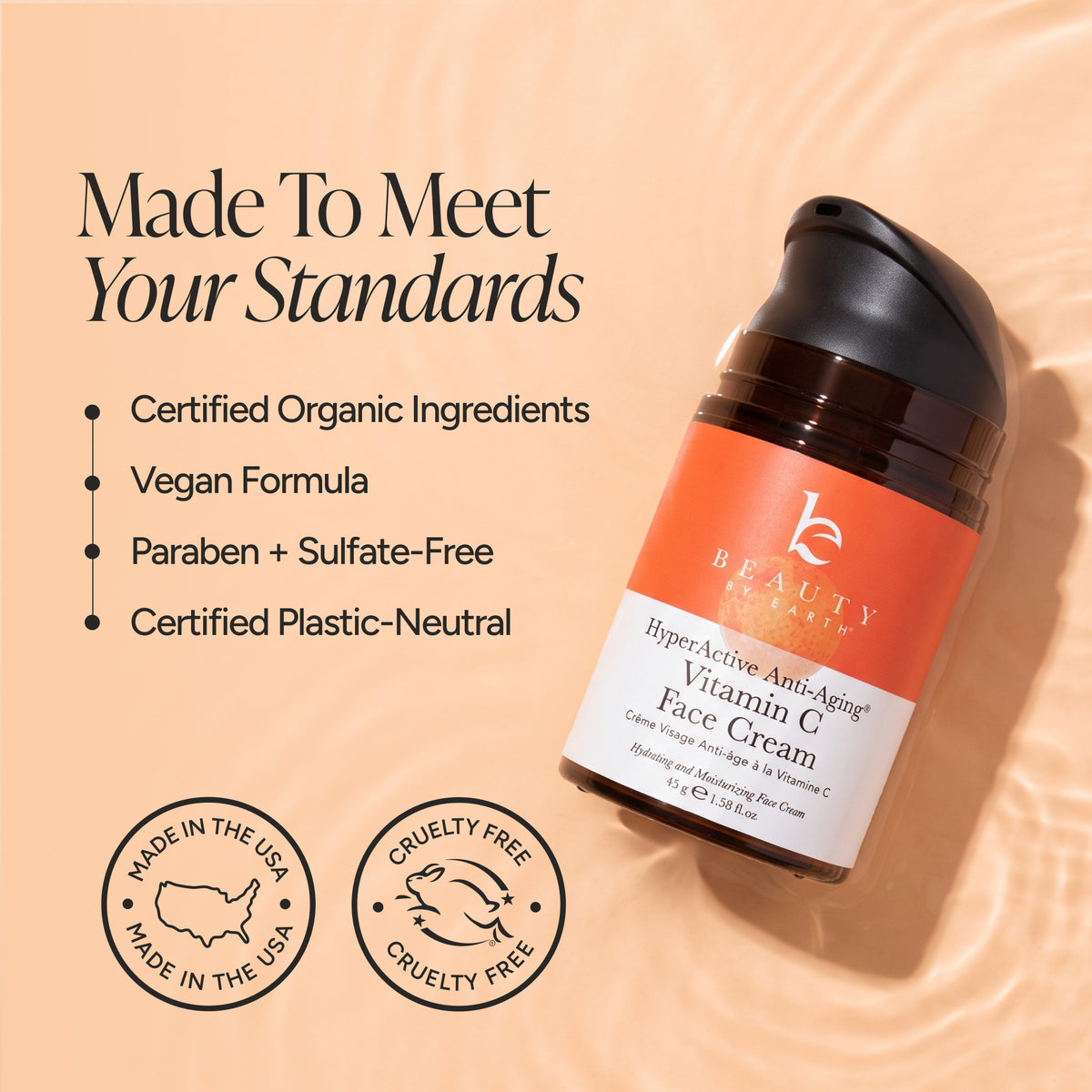 Beauty of Earth Hyper-Active Anti-Aging Vitamin C Face Cream in a dark amber pump bottle with an orange and white label, set against a warm peach liquid ripple background with marketing text and certification badges.