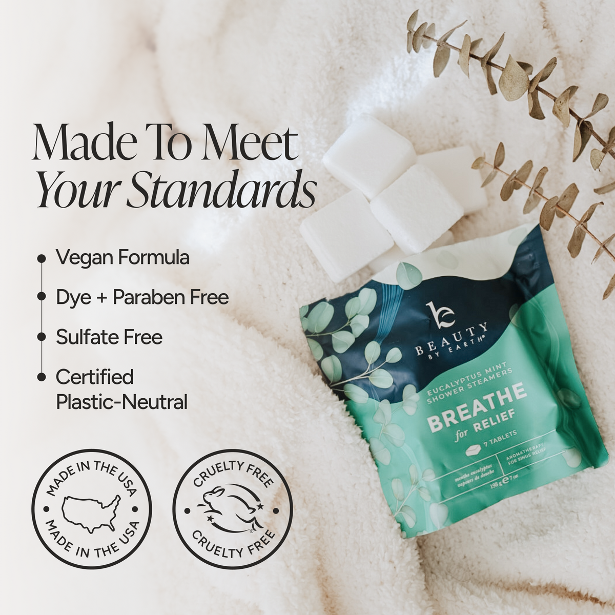 A pouch of Beauty by Earth Breathe for Relief sugar-free mint nicotine gum tablets is displayed on a soft white textured blanket with decorative eucalyptus leaves and white sugar cubes. Text on the left highlights product benefits: vegan formula, dye and paraben free, sulfate free, and certified plastic-neutral.