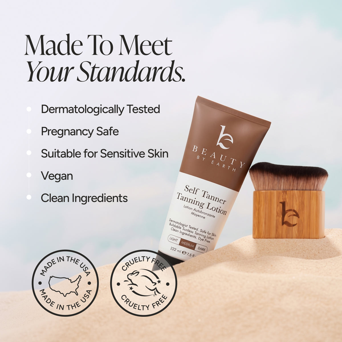 Beauty by Earth Self Tanner Tanning Lotion tube standing on sand next to a wooden-handled brush, with marketing text and certification seals on a pale sky-blue background.