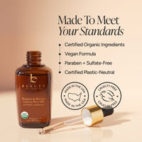 Amber glass bottle of Beauty by Earth Balance & Restore Luxury Face Oil with a gold-and-black dropper, shown on a warm beige background with marketing text and certification-style icons.