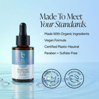 Beauty by Earth Hyaluronic Acid Serum in an amber glass dropper bottle with a black cap, set against a light blue water-textured background with product benefits and certification badges.