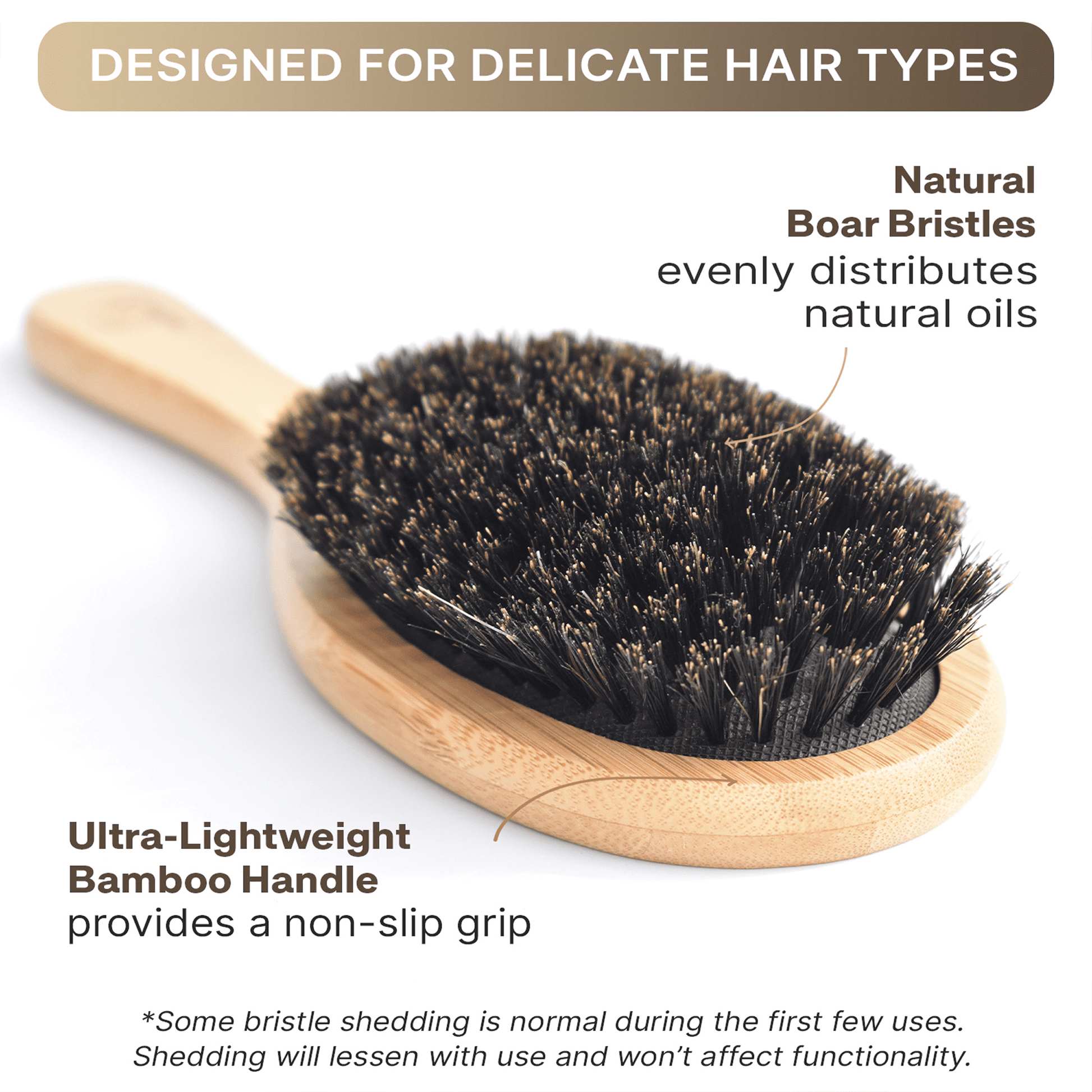 Hairbrush with natural boar bristles and wooden handle on a white background