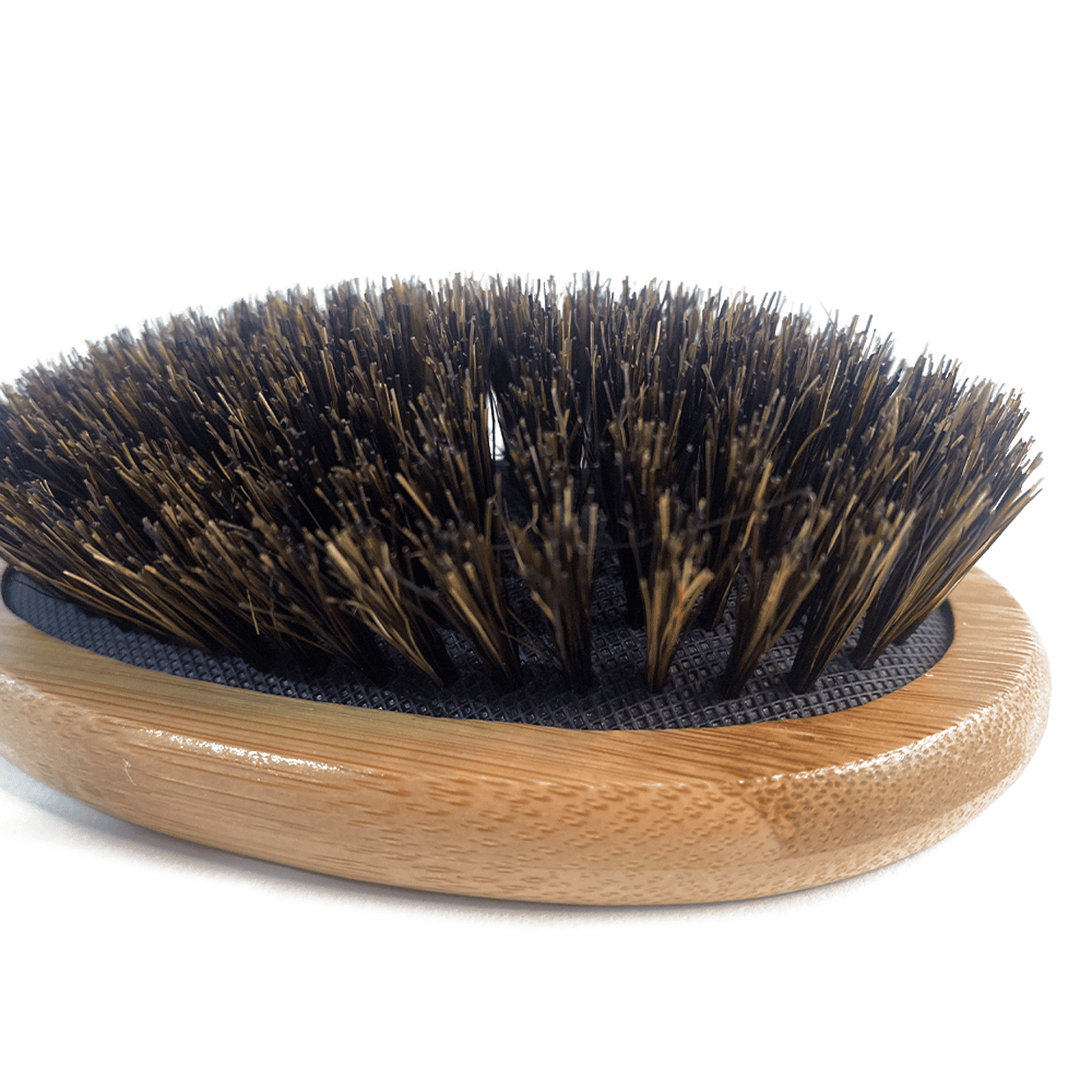 Bristle brush with wooden handle on a white background