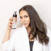 Beauty by Earth Self Tanner Mousse in Beautiful Woman's Hand