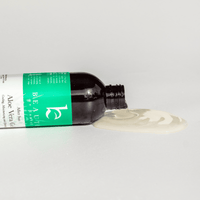Bottle of aloe vera gel with a green label on a white background