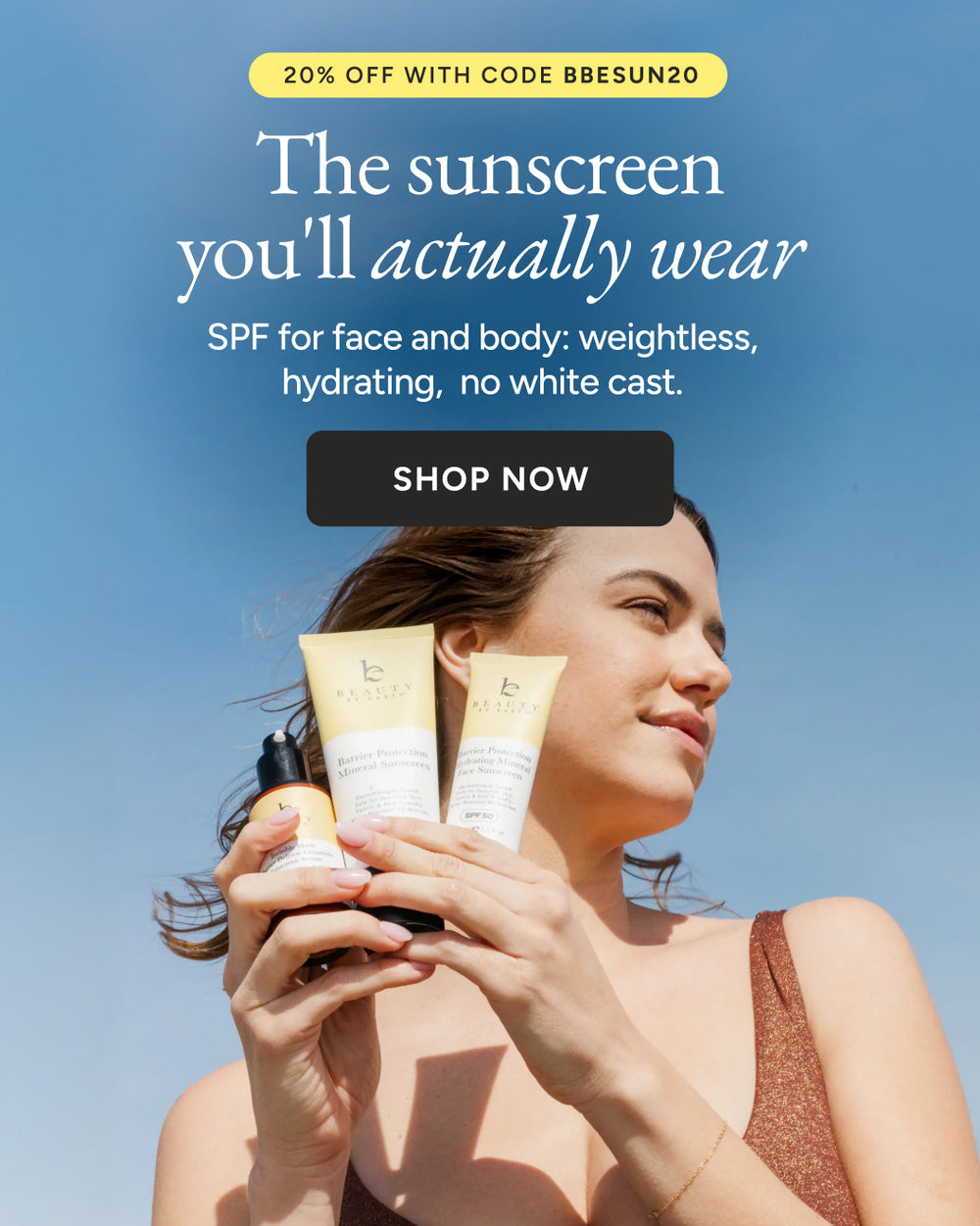 Woman holding sunscreen bottles with a promotional message on a blue sky background