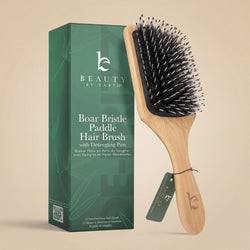 Boar Bristle Paddle Hair Brush with Detangling Pins from Beauty by Earth on a beige background