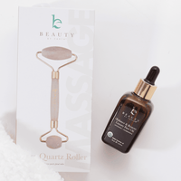 Beauty by Earth roller and face oil on a white background