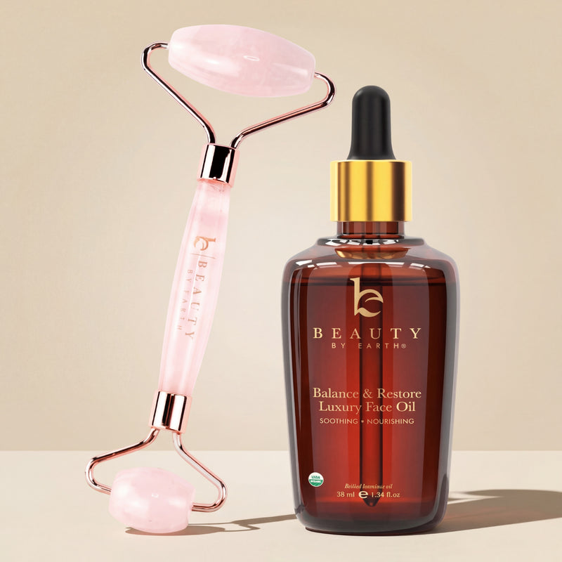 Beauty by Earthy face oil bottle with pink roller on beige background