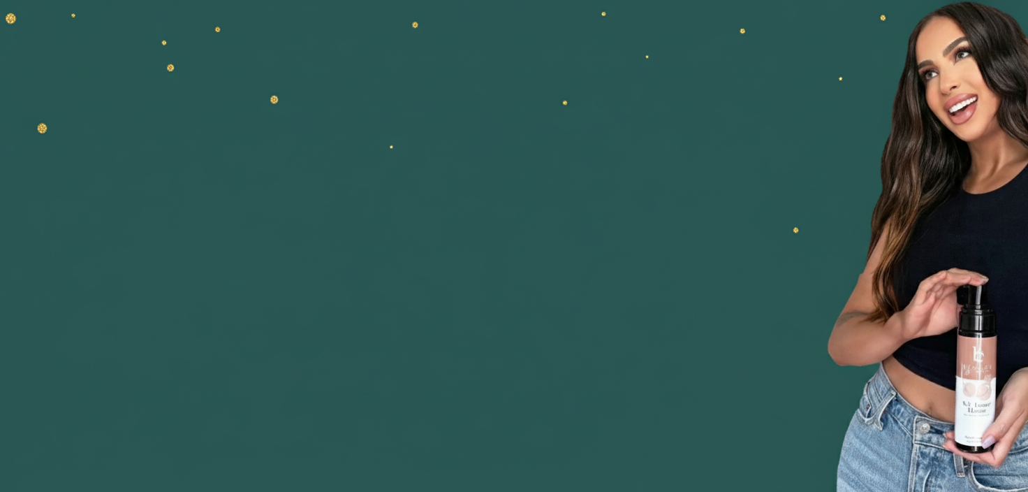 Woman holding a self tanner mousse bottle against a teal background with gold dots