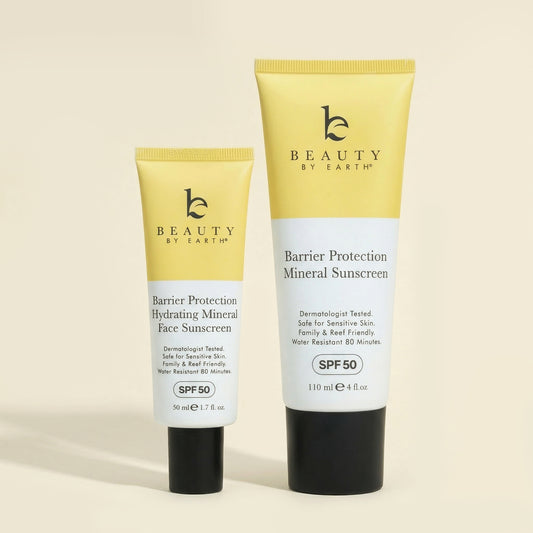 Two tubes of 'Beauty by Earth' Barrier Protection Mineral sunscreen on a beige background