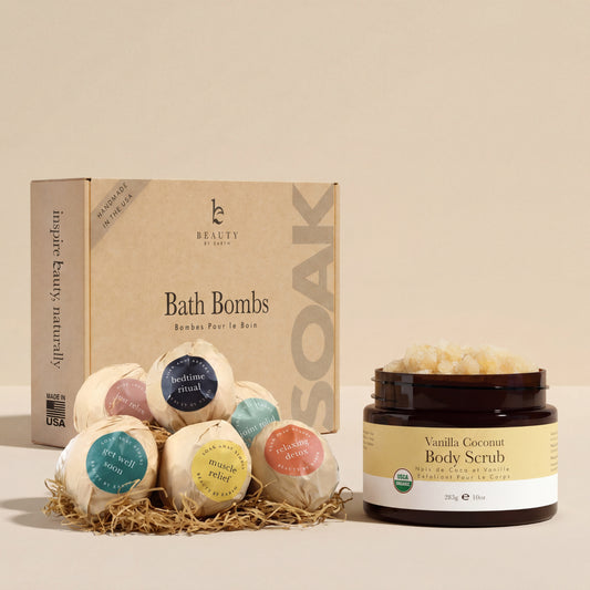 Bath bombs with labeled ingredients and a jar of vanilla coconut body scrub on a white background.