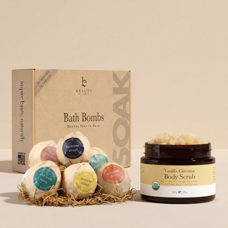 Bath bombs with labeled ingredients and a jar of vanilla coconut body scrub on a white background.