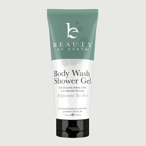 Body wash shower gel peppermint tea tree tube with 'Beauty by Earth' branding on a light gray background