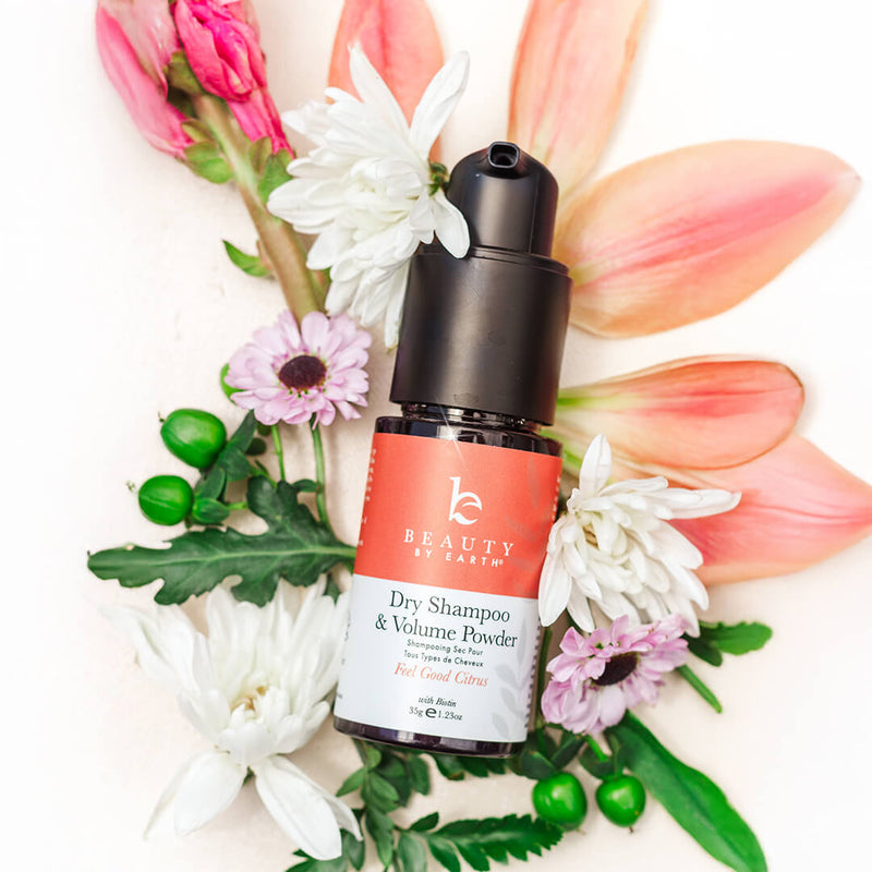 Dry shampoo flatlay on flowers