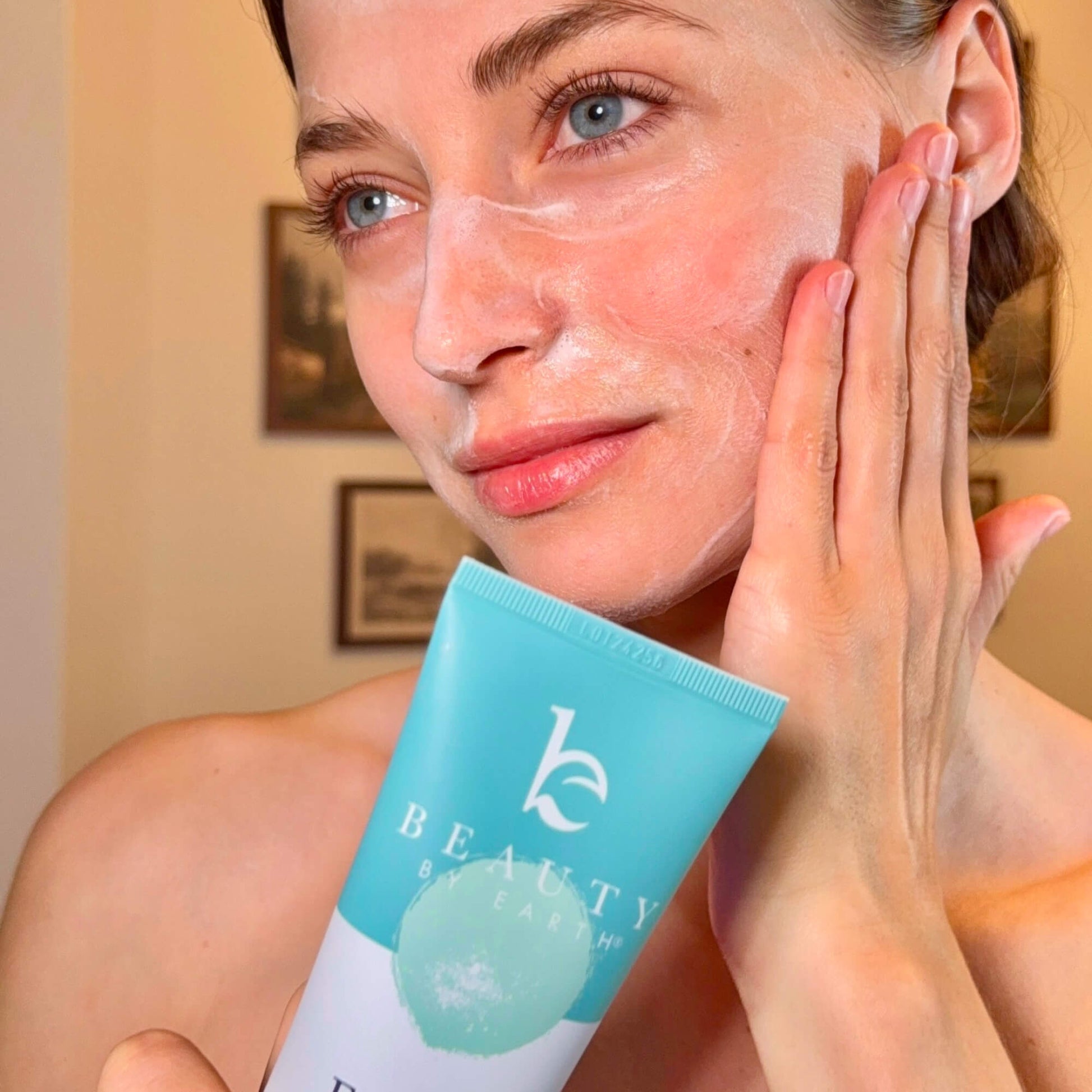 Woman applying face wash
