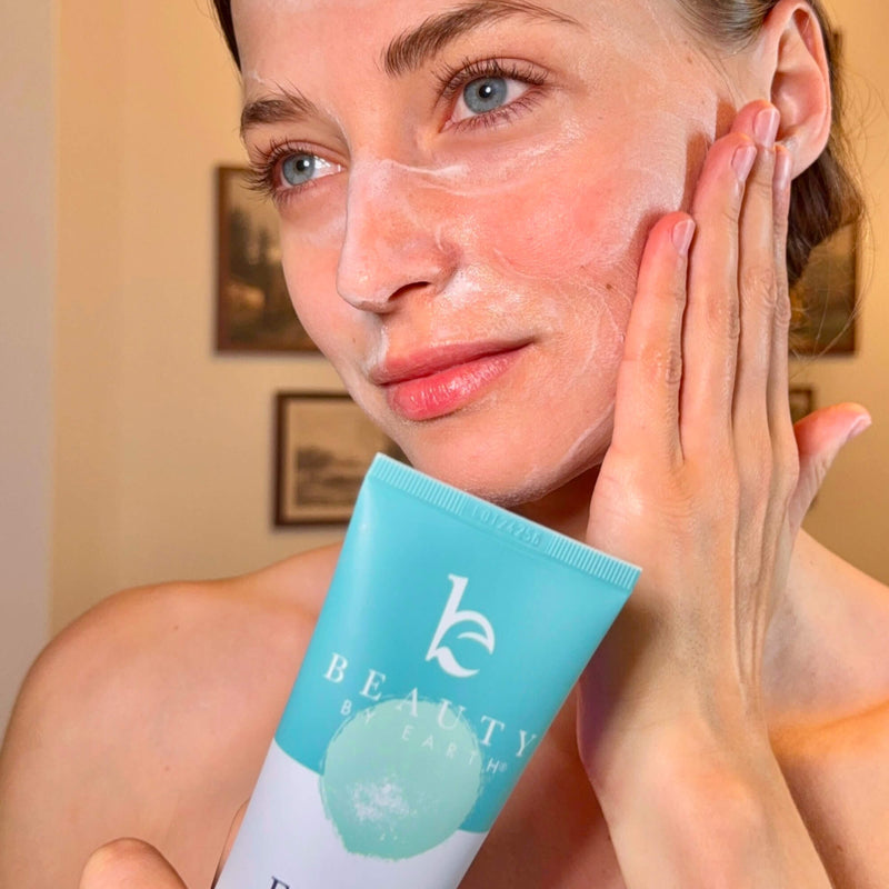 Woman applying face wash