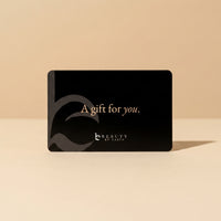 Black gift card with 'A gift for you.' text on a beige background