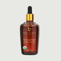 Bottle of Beauty by Eartho luxury face oil on a light gray background