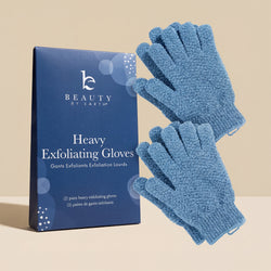 Blue exfoliating gloves with packaging on a beige background